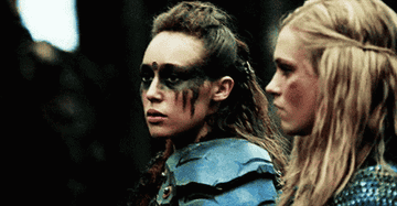 Alycia Debnam-Carey as Lexa and Eliza Taylor as Clarke Griffin in battle armor, from "The 100"