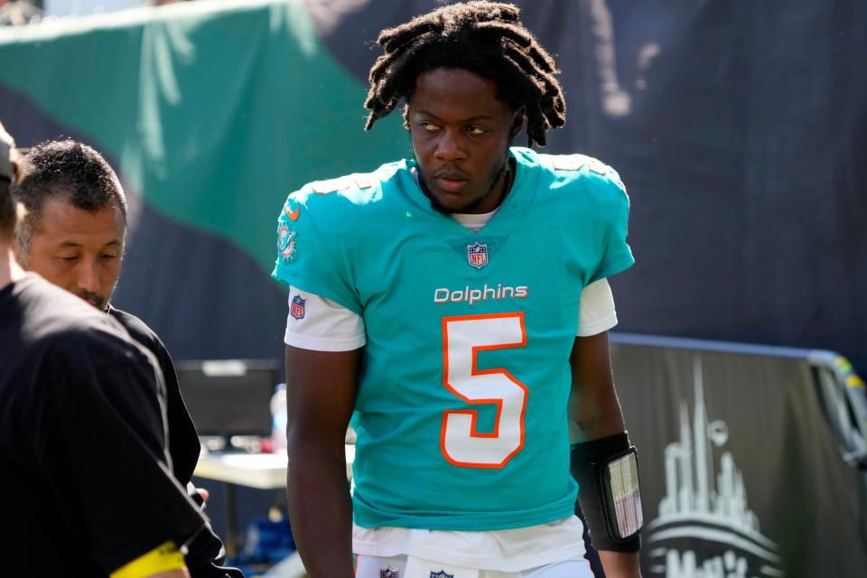 Dolphins quarterback Teddy Bridgewater walks off the field after being tackled in the end zone against the Jets.