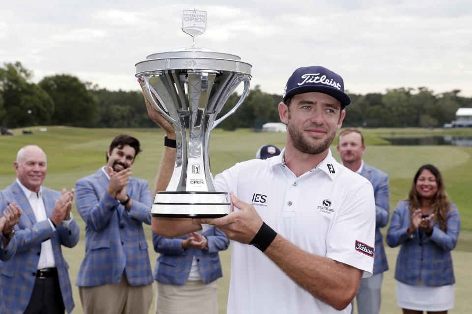 Lanto Griffin hoists the Championship trophy during presentation ceremonies after winning the Houston Open golf tournament Sunday, Oct, 13, 2019, in Houston. (AP Photo/Michael Wyke)