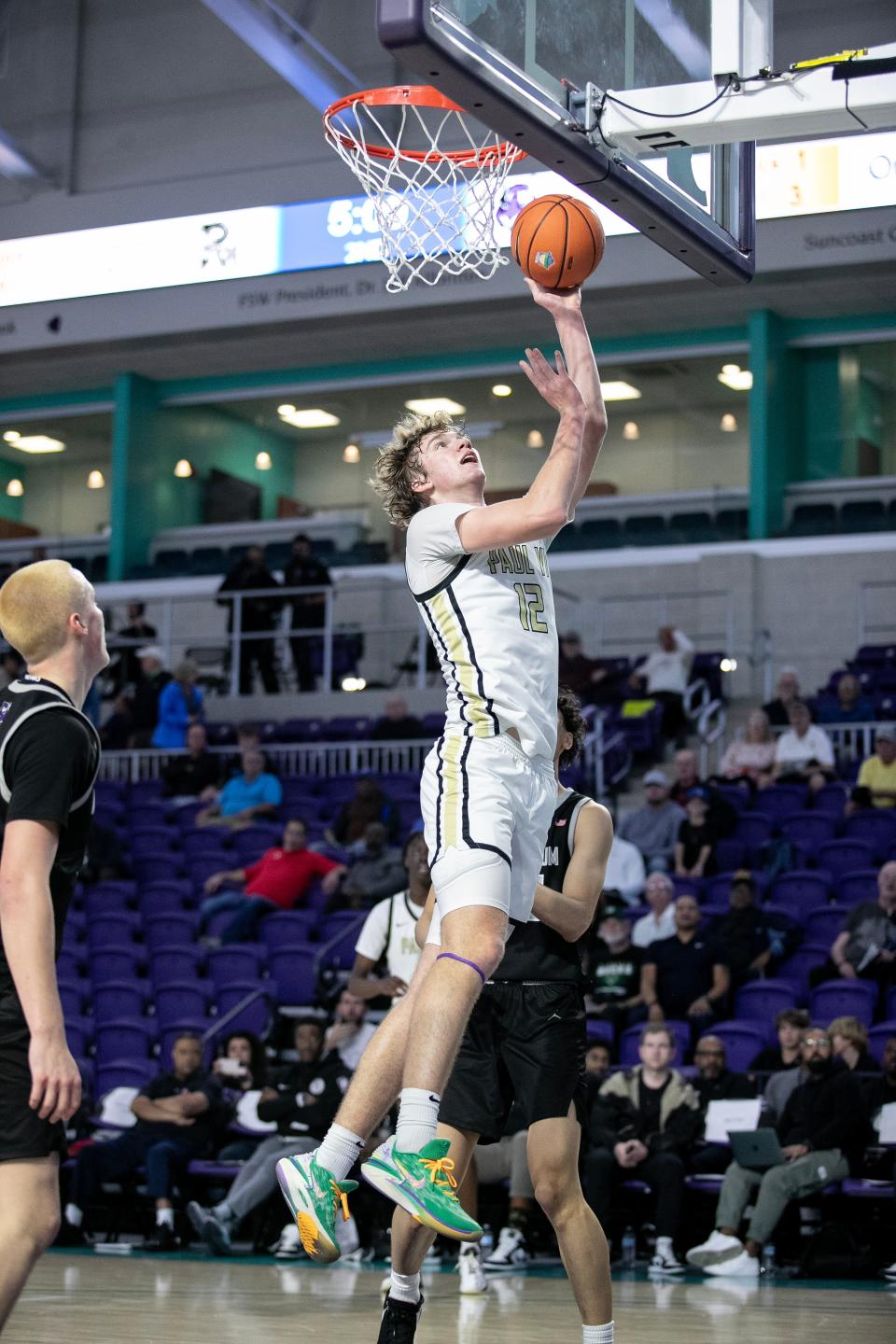 Garrett Sundra of Paul VI Catholic High School takes a shot against Millennium High School in the City of Palms Classic on Monday, Dec. 18, 2023, at Suncoast Credit Union Arena in Fort Myers.