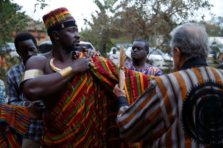 A model receives final touches behind the scenes of a fashion show featuring African fashion and culture as part of a gala marking the launch of a book called "African Twilight: The Vanishing Rituals and Ceremonies of the African Continent" at the African Heritage House in Nairobi, Kenya March 3, 2019. REUTERS/Baz Ratner