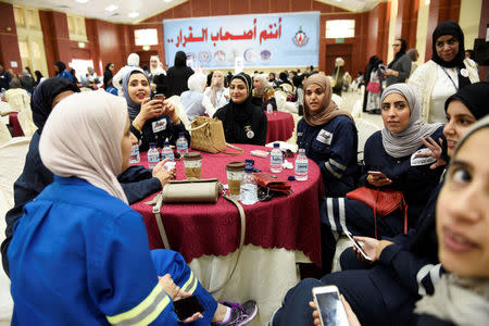 Female oil sector employees sit in a hall on the first day of an official strike called by the Oil and Petrochemical Industries Workers Union over public sector pay reforms, in Ahmadi, Kuwait April 17, 2016. REUTERS/Stephanie McGehee/File Photo
