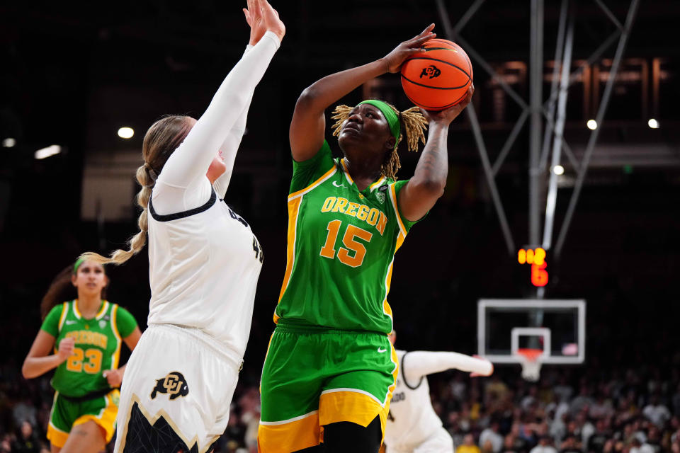 Oregon Ducks center Phillipina Kyei (15) shoots the ball at Colorado Buffaloes forward Charlotte Whittaker (45) in the second quarter at CU Events Center Feb 9, 2024, in Boulder, Colorado.