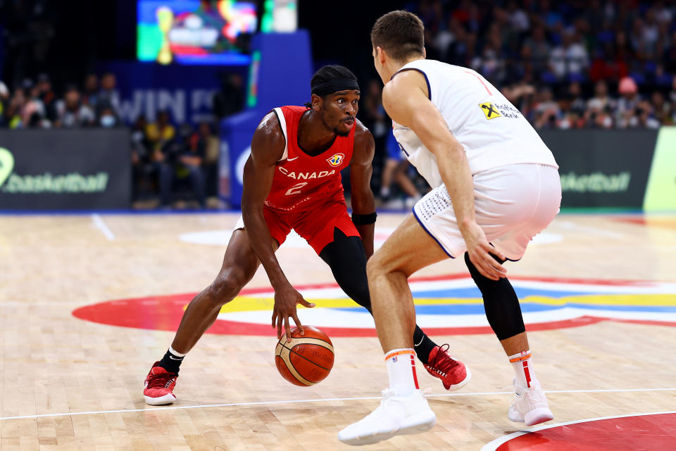MANILA, PHILIPPINES - SEPTEMBER 08: Shai Gilgeous-Alexander #2 of Canada controls the ball against Bogdan Bogdanovic #7 of Serbia in the fourth quarter during the FIBA Basketball World Cup semifinal game at Mall of Asia Arena on September 08, 2023 in Manila, Philippines. (Photo by Yong Teck Lim/Getty Images)
