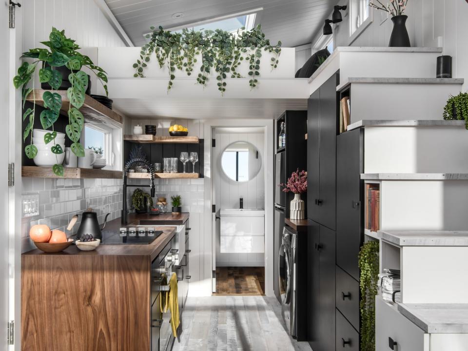 the kitchen space in front of the bathroom next to the staircase