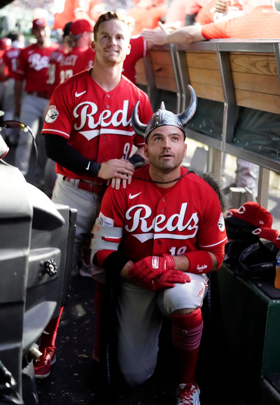 Joey Votto dons the team's Viking helmet after hitting a two-run home run against the Chicago Cubs at Wrigley Field in August.