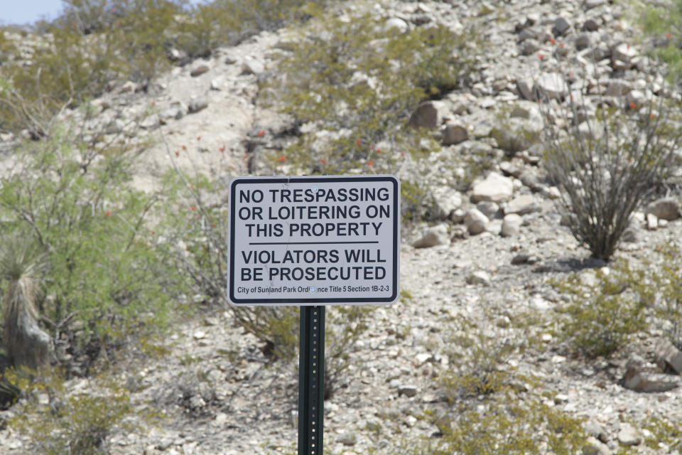 A no-trespassing sign installed this week by the city of Sunland Park, N.M., is seen Tuesday, April 23, 2019. The city put up the sign to discourage citizen immigration patrols by members of the United Constitutional Patriots. The group gained national attention after filming themselves detaining immigrants who cross the border to the east where the wall ends. (AP Photo/Cedar Attanasio)