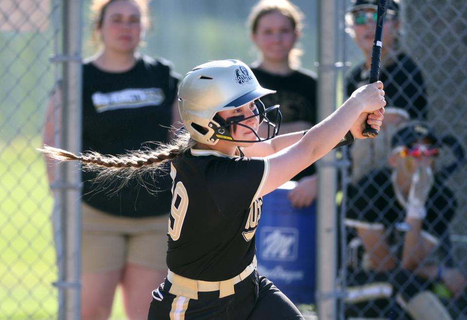 Rush-Henrietta’s Elizabeth Gleghorn singles against Churchville-Chili. 