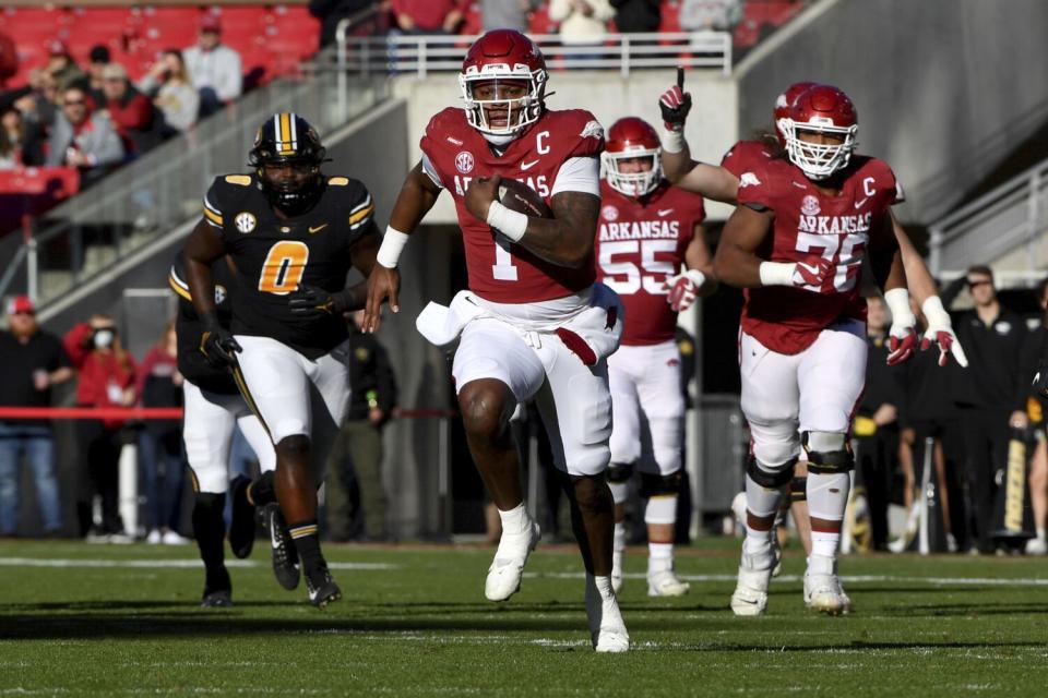 Arkansas quarterback KJ Jefferson breaks through the Missouri defense during a game in November.