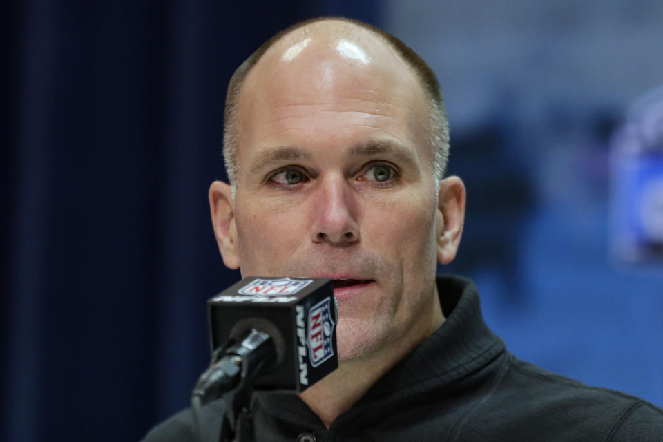 FILE - Baltimore Ravens general manager Eric DeCosta speaks during a press conference at the NFL football scouting combine in Indianapolis, in this Tuesday, Feb. 25, 2020, file photo. DeCosta has already started making some of the tough decisions he believes can help Baltimore negotiate the leap from playoff qualifier to Super Bowl champion. After releasing running back Mark Ingram and quarterback Robert Griffin III last week, DeCosta announced Monday, Jan. 25, 2021, that the Ravens won't re-sign All-Pro long snapper Morgan Cox, the initial component of the highly successful placekicking trio that includes holder Sam Koch and second-team All-Pro Justin Tucker, the most accurate field goal kicker in NFL history.(AP Photo/Michael Conroy, File)