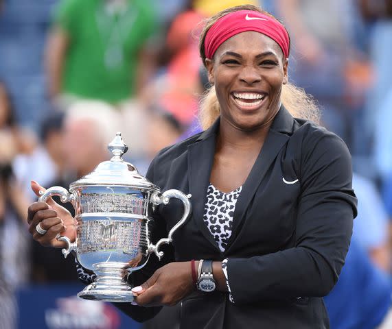 <p>STAN HONDA/AFP via Getty </p> Serena Williams smiling