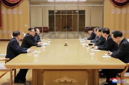 North Korean leader Kim Jong Un meets members of the special delegation of South Korea's President in this photo released by North Korea's Korean Central News Agency (KCNA) on March 6, 2018. KCNA/via Reuters