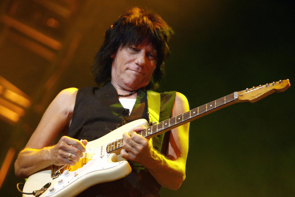 FILE - British guitarist Jeff Beck performs on the Stravinski hall during the 41st Montreux Jazz Festival in Montreux, Switzerland, late Sunday, July 15, 2007. Beck, a guitar virtuoso who pushed the boundaries of blues, jazz and rock ‘n’ roll, influencing generations of shredders along the way and becoming known as the guitar player’s guitar player, died Tuesday, Jan. 10, 2023, after “suddenly contracting bacterial meningitis,” his representatives said in a statement released Wednesday. He was 78. (Laurent Gillieron/Keystone via AP, File)