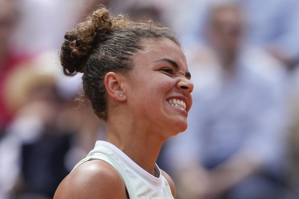 Italy's Jasmine Paolini reacts after missing a shot against Poland's Iga Swiatek during the women's final of the French Open tennis tournament at the Roland Garros stadium in Paris, France, Saturday, June 8, 2024. (AP Photo/Thibault Camus)