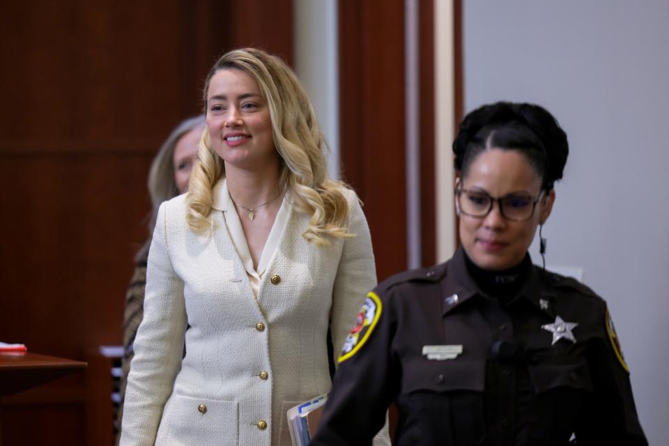 Amber Heard arrives in the courtroom on April 20 as Johnny Depp testifies against him in their libel lawsuit.