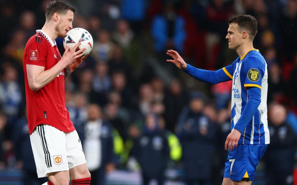 Brighton's Solly March is passed the ball by Manchester United's Wout Weghorst before missing his penalty - Marc Atkins/Getty Images