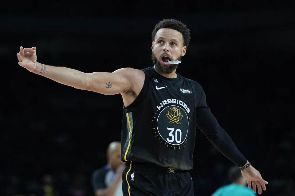 Golden State Warriors guard Stephen Curry (30) celebrates after a score against the San Antonio Spurs during the second half of an NBA basketball game in San Antonio, Friday, Jan. 13, 2023. (AP Photo/Eric Gay)