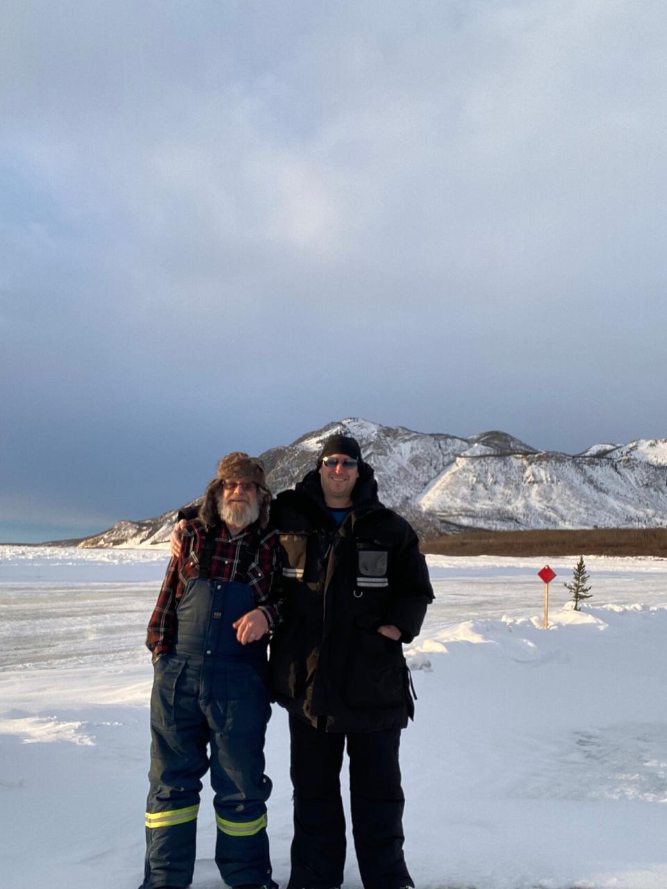 Dustin Dewar (right) with colleague Michael Hempler on the Mackenzie River ice crossing at Tulita. This year, he said that the Tulita winter road and others along the Mackenzie Valley had a "fairly typical" season.