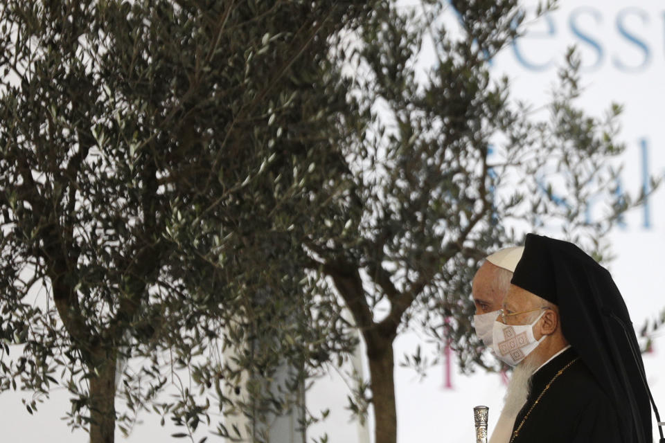 Pope Francis and Bartolomew I, Patriarch of Constantinopolis, walk by olive trees during an inter-religious ceremony for peace in the square outside Rome's City Hall, Tuesday, Oct. 20, 2020 (AP Photo/Gregorio Borgia)