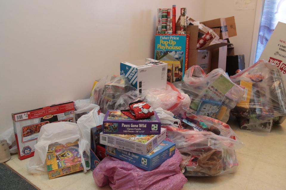 Toys and wrapping paper await distribution in the Tecumseh Service Club's Sponsor-a-Family program.