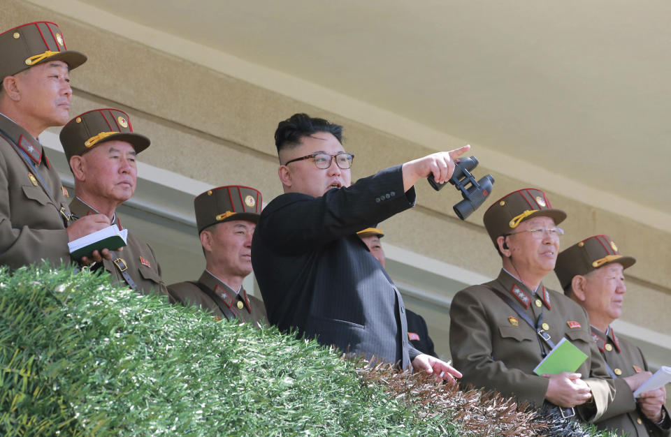 In this undated photo distributed on Friday, April 14, 2017, by the North Korean government, North Korean leader Kim Jong Un, center, watches a military drill at an undisclosed location. Independent journalists were not given access to cover the event depicted in this photo, distributed via the Korean Central News Agency and the Korea News Service. Tensions are deepening as the U.S. has sent the USS Carl Vinson to waters off the Korean peninsula and is conducting its biggest-ever joint military exercises with South Korea. North Korea recently launched a ballistic missile and some experts say it could conduct another nuclear test at virtually anytime. (Korean Central News Agency/Korea News Service via AP)
