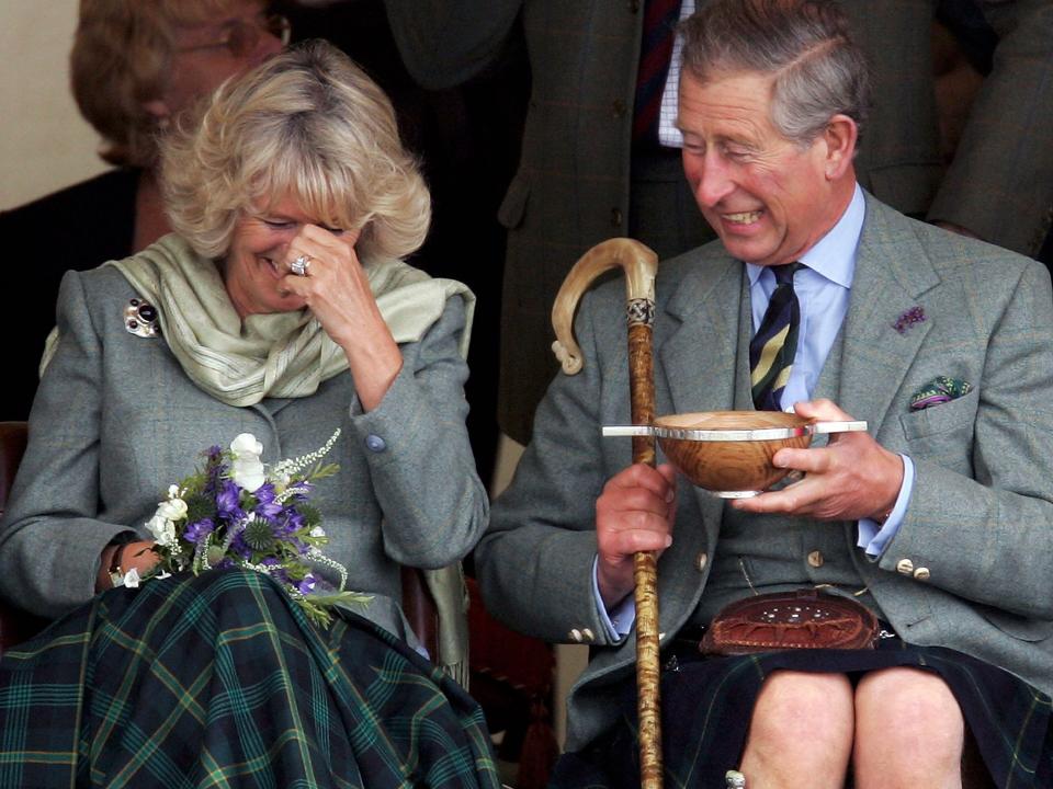 charles and camilla laughing together at the 2005 Mey Games