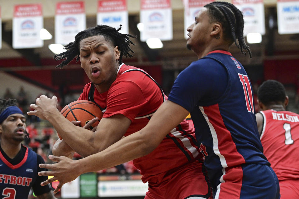 Youngstown State forward Malek Green pulls in a rebound against Detroit Mercy forward Gerald Liddell during the first half of an NCAA college basketball game in the quarterfinals of the Horizon League tournament Thursday, March 2, 2023, in Youngstown, Ohio.(AP Photo/David Dermer)