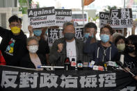 Pro-democracy activist Lee Cheuk-yan, center, arrives at a court in Hong Kong Friday, April 16, 2021. Seven of Hong Kong’s leading pro-democracy advocates, including Lee, 82-year-old veteran activist Martin Lee and pro-democracy media tycoon Jimmy Lai, are expected to be sentenced Friday for organizing a march during the 2019 anti-government protests that triggered an overwhelming crackdown from Beijing. (AP Photo/Kin Cheung)