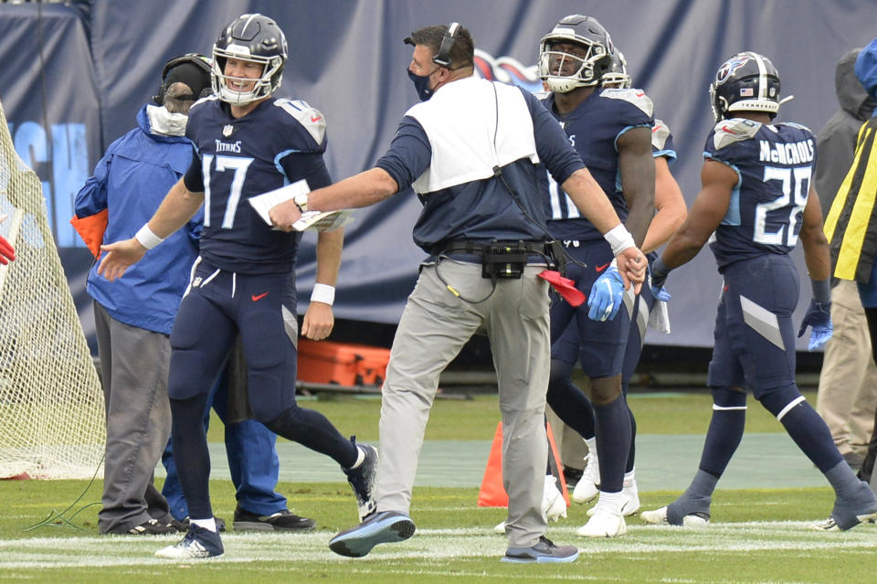 Tennessee Titans head coach Mike Vrabel celebrates with quarterback Ryan Tannehill (17) after a touchdown against the Houston Texans in the first half of an NFL football game Sunday, Oct. 18, 2020, in Nashville, Tenn. (AP Photo/Mark Zaleski)