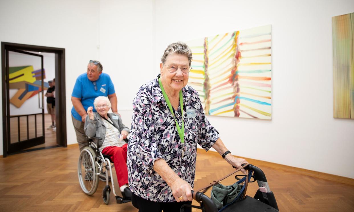 <span>Annie Versteeg is followed by Bwieuwkje Bruinenberg-Haisma, being pushed by her son Harry, through Kunstmuseum Den Haag.</span><span>Photograph: Judith Jockel/The Guardian</span>