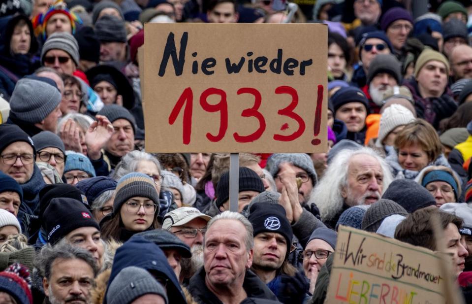 A sign at a German protest reads 'Never again 1933.'