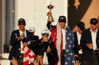 <p>Zach Johnson of the United States sprays champagne as captain Davis Love III holds the Ryder Cup during the closing ceremony of the 2016 Ryder Cup at Hazeltine National Golf Club on October 2, 2016 in Chaska, Minnesota. (Photo by Streeter Lecka/Getty Images)</p>