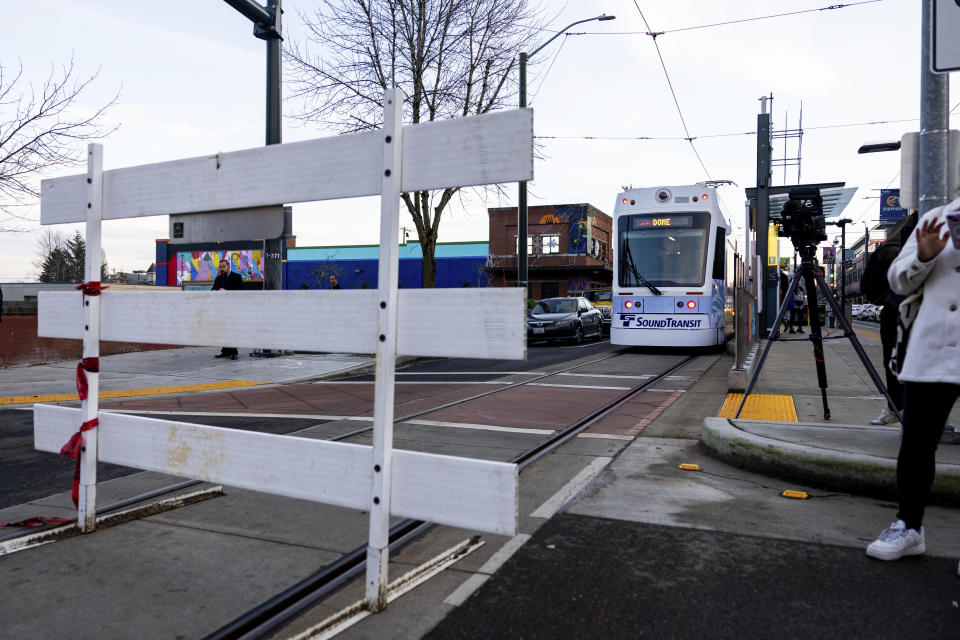 The Tacoma Link Light Rail is blocked during a rally after the verdict is read during the trial of three Tacoma Police officers in the killing of Manny Ellis, at Pierce County Superior Court, Thursday, Dec. 21, 2023, in Tacoma, Wash. (AP Photo/Maddy Grassy)