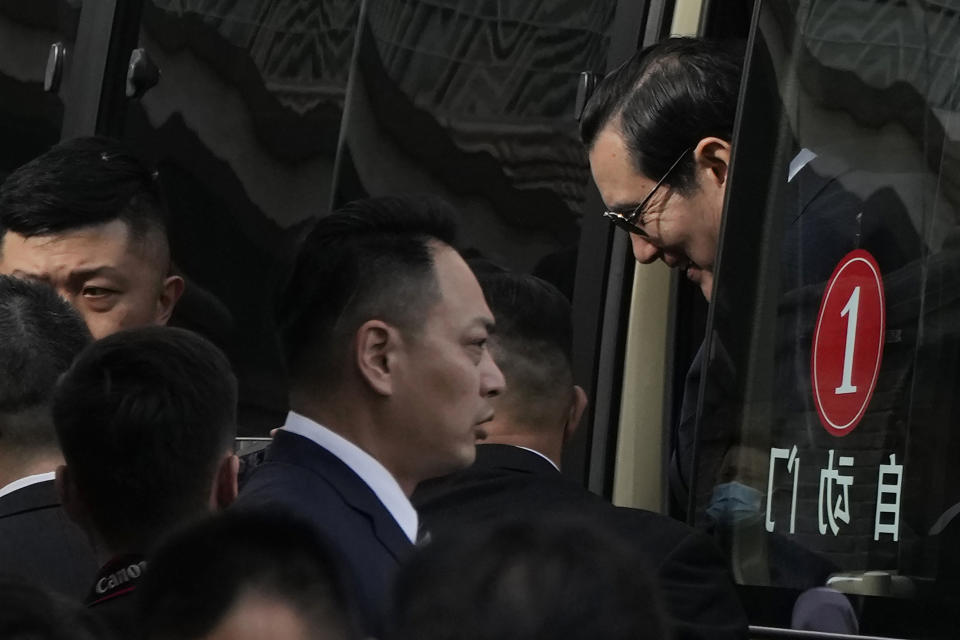 Former Taiwan President Ma Ying-jeou walks down from a minibus during a visit to the John Rabe Former Residence in Nanjing, in eastern China's Jiangsu province, Tuesday, March 28, 2023. Former Taiwan President Ma Ying-jeou began a 12-day tour of China with a symbolism-laden visit to the mausoleum where the founding father of both China and Taiwan is entombed. (AP Photo/Ng Han Guan)