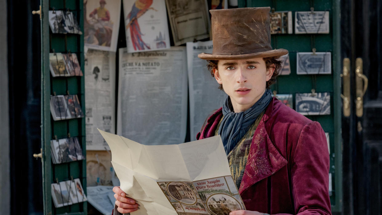  Timothée Chalamet in his red coat as Willy Wonka in Wonka. 