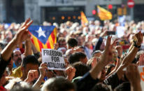 A crowd of protesters gather outside the Catalan region's economy ministry after junior economy minister Josep Maria Jove was arrested by Spanish police during a raid on several government offices, in Barcelona, Spain, September 20, 2017. REUTERS/Albert Gea