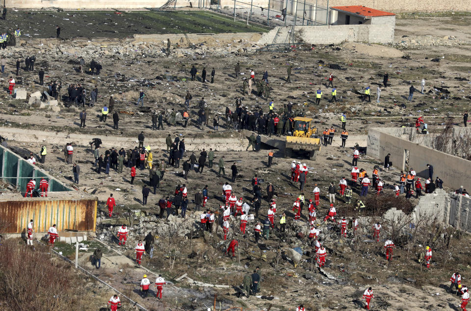 Rescue workers search the scene where an Ukrainian plane crashed in Shahedshahr southwest of the capital Tehran, Iran, Wednesday, Jan. 8, 2020.  (Photo: Ebrahim Noroozi/AP)