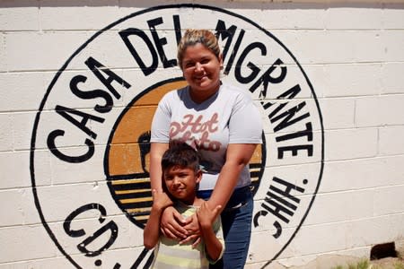Honduran migrant Denia Carranza and her son Robert, who have given up their U.S. asylum claim under the Migrant Protection Protocol (MPP), pose for a photo at Casa del Migrante migrant shelter, in Ciudad Juarez