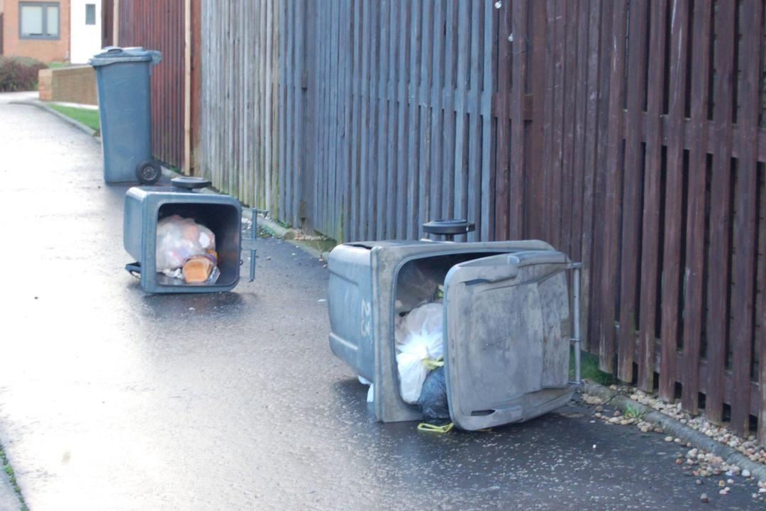 Displaced wheelie bins r in Muirhouse, Edinburgh after storm Isha blew through the area overnight. Picture date: Monday January 22, 2024.