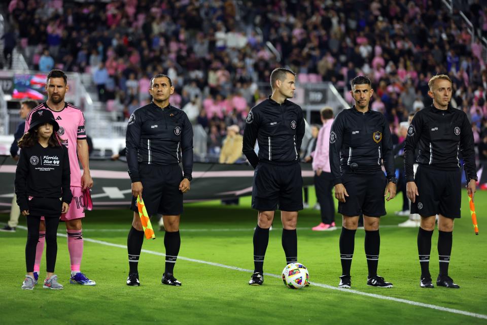 Lionel Messi #10 of Inter Miami stands next to the group of replacement referees ahead of the first half against Real Salt Lake at Chase Stadium on February 21, 2024 in Fort Lauderdale, Florida. Major League Soccer locked out referees after its union rejected a tentative contract.