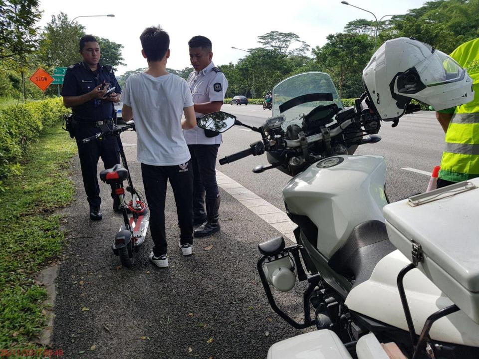 A man was caught by the Land Transport Authority and Traffic Police for riding his e-scooter along the PIE on Sunday (26 Nov). Photo: LTA