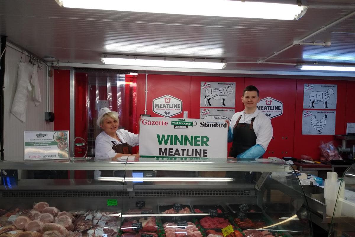 Winners - Meatline staff and the winner's banner <i>(Image: Newsquest)</i>