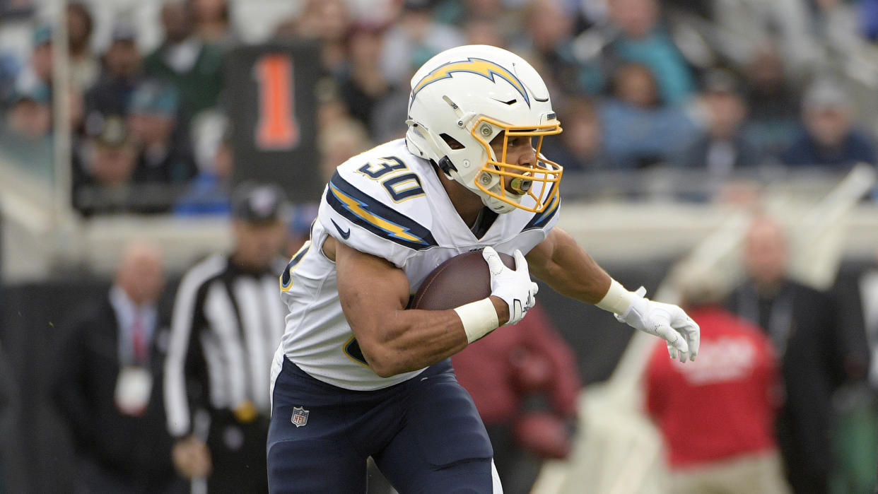 Austin Ekeler and the Chargers will feature an overhauled roster, a new stadium and a new logo the next time they take the field. (AP Photo/Phelan M. Ebenhack)