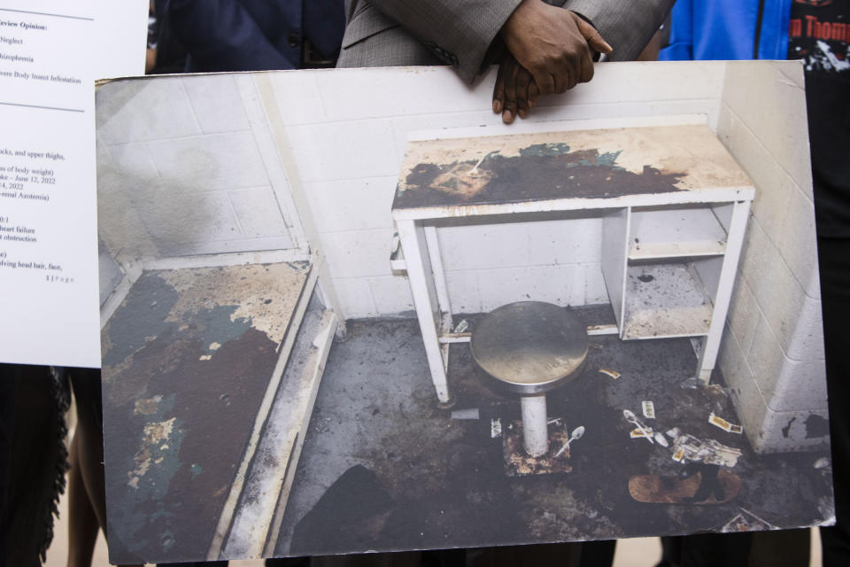 FILE - Attorney Michael Harper holds a photo of Lashawn Thompson's cell in the Fulton County, Ga., Jail at a news conference, May 22, 2023, at the state Capital in Atlanta. Thompson died in the bedbug-infested cell in the county jail’s psychiatric wing in 2023. The Fulton County Sheriff said Friday, July 12, 2024, that a decision this week not to move forward with plans to build a new jail is short sighted. (Christina Matacotta/Atlanta Journal-Constitution via AP, File)