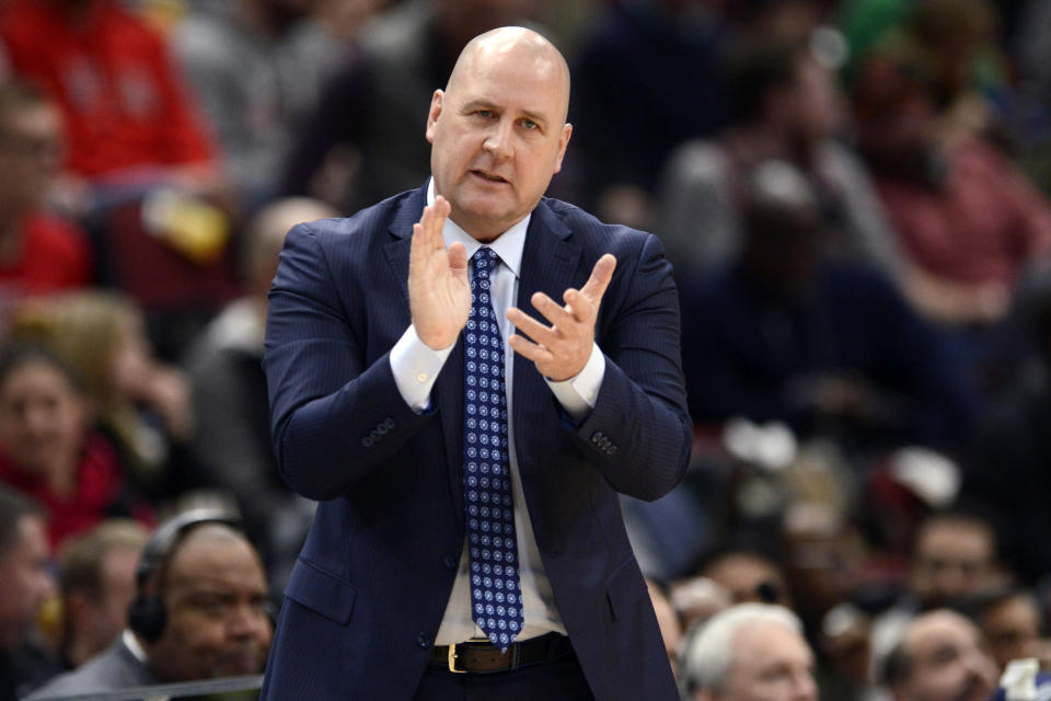 FILE - In this March 10, 2020, file photo, Chicago Bulls coach Jim Boylen cheers on players during the first half of the team's NBA basketball game against the Cleveland Cavaliers in Chicago. Boylen's future is the biggest issue hanging over the Bulls, who were left out when the NBA’s Board of Governors approved a 22-team format to restart the pandemic-interrupted season next month in Orlando. (AP Photo/Paul Beaty, File)