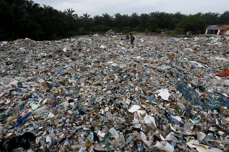 Plastic waste are piled outside an illegal recycling factory in Jenjarom, Kuala Langat, Malaysia October 14, 2018. Picture taken October 14, 2018. REUTERS/Lai Seng Sin