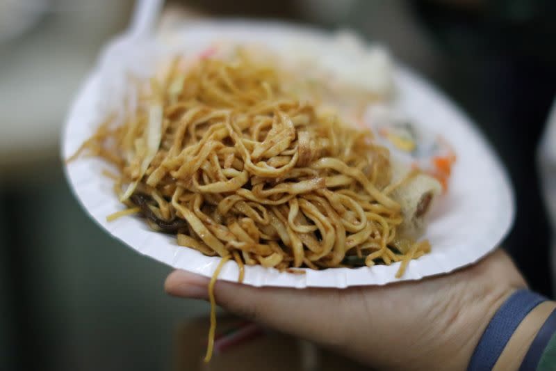 Protesters serve themselves with free Christmas dinner offered by a local restaurant in Hong Kong