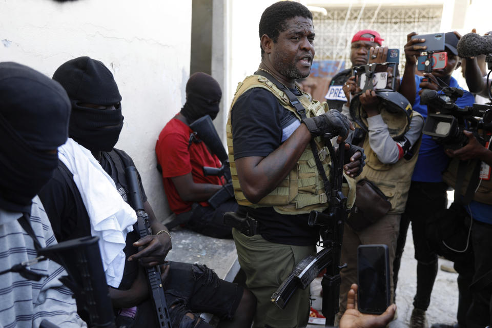 Barbecue, the leader of the "G9 and Family" gang, speaks to journalists in the Delmas 6 neighborhood of Port-au-Prince in Port-au-Prince, Haiti, Tuesday, March 5, 2024. Haiti's latest violence began with a direct challenge from Barbecue, a former elite police officer, who said he would target government ministers to prevent the prime minister's return and force his resignation. (AP Photo/Odelyn Joseph)