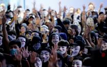 Protesters wearing Guy Fawkes masks attend an anti-government demonstration in Hong Kong