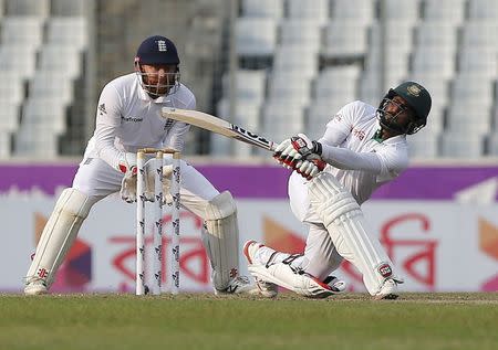 Cricket - Bangladesh v England - Second Test cricket match - Sher-e-Bangla Stadium, Dhaka, Bangladesh - 29/10/16. Bangladesh's Imrul Kayes (R) plays a shot as England's wicketkeeper Jonathan Bairstow looks on. REUTERS/Mohammad Ponir Hossain